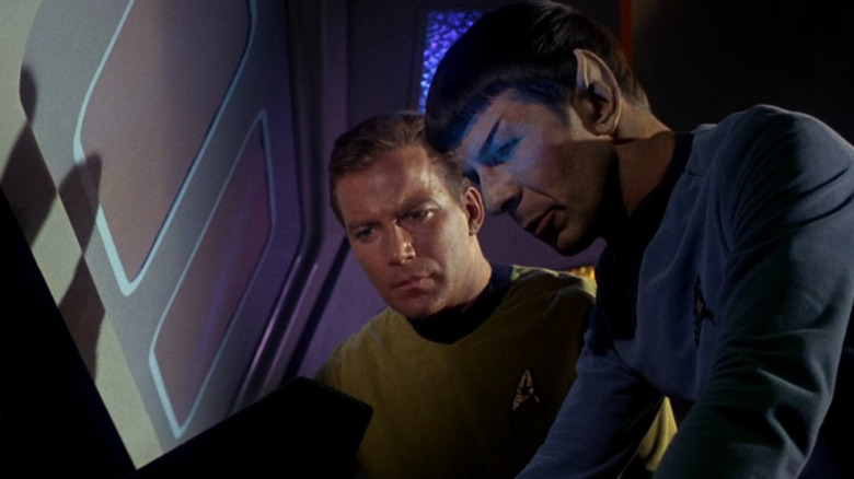 Spock (Leonard Nimoy) and Kirk (William Shatner) staring at the same screen on Star Trek: The Original Series