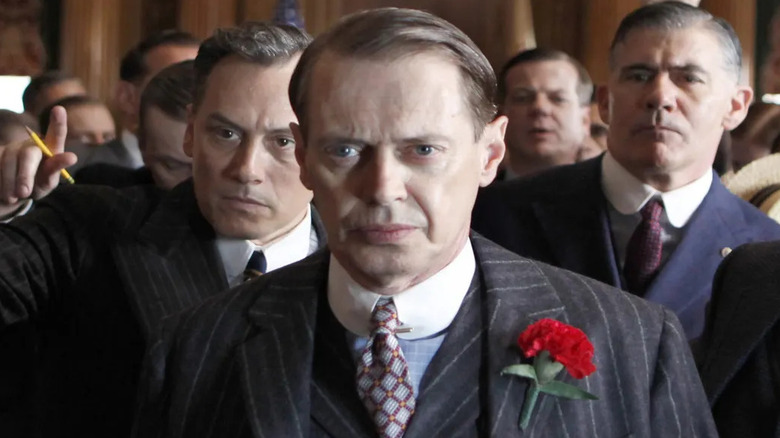 Nucky Thompson being escorted from a courtroom