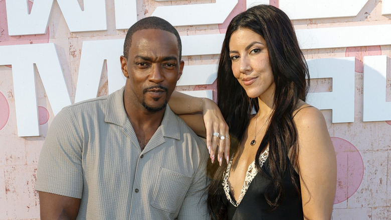 Anthony Mackie and Stephanie Beatriz smiling at a Twisted Metal event