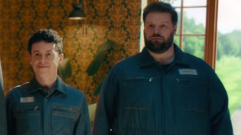 DUM-E and U standing side by side in "VisionQuest"