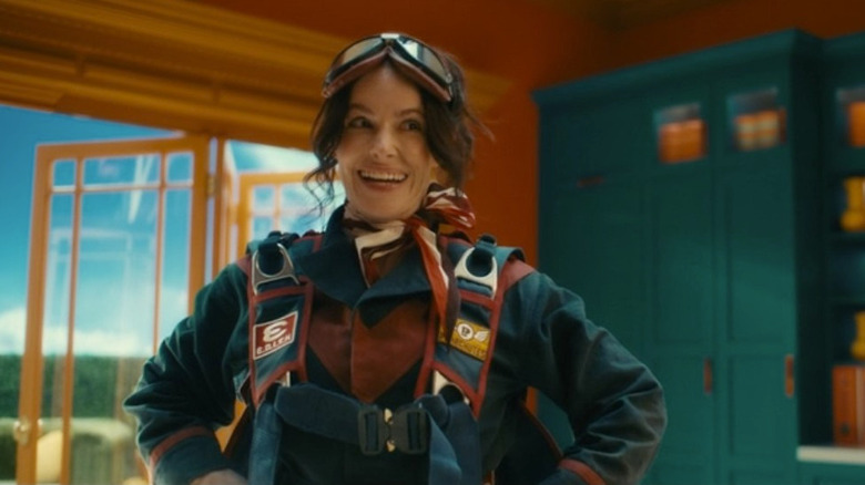 E.D.I.T.H. smiling brightly with hands on hips in "VisionQuest"