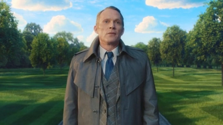 The Vision standing on path in park in "VisionQuest"