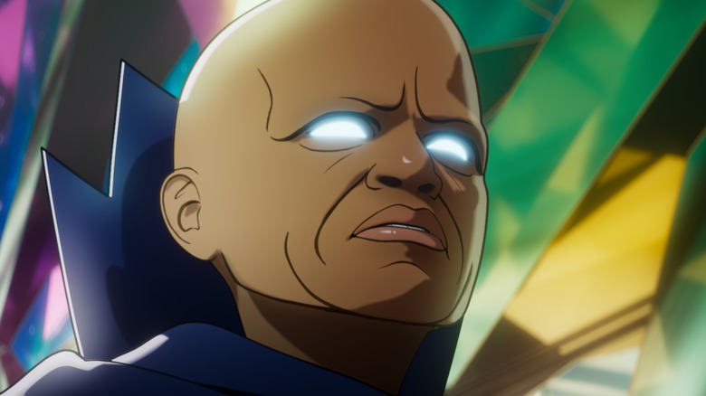 Uatu the Watcher wears a blue robe and has bright white eyes in front of a colorful background in "What If."