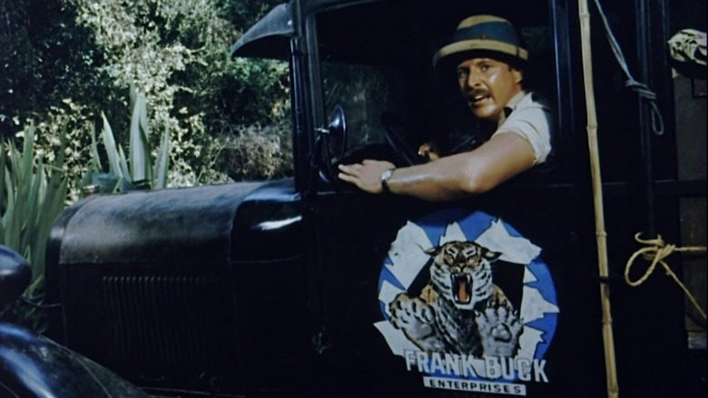 Frank Buck driving a branded vehicle in "Bring 'Em Back Alive"