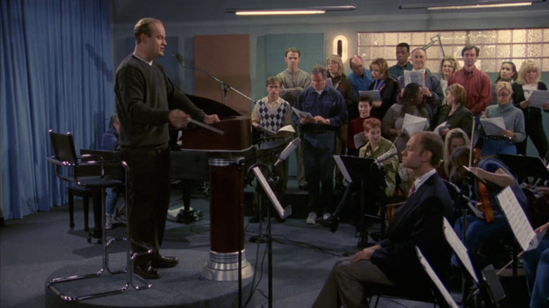 Kelsey Grammer's Frasier Crane conducts a room of musicians in Frasier