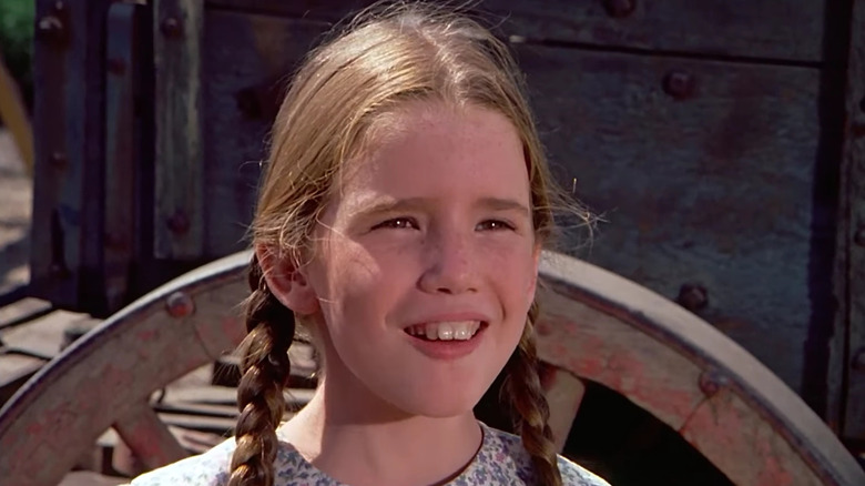 Melissa Gilbert as Laura is delighted by a suggestion on Little House on the Prairie.