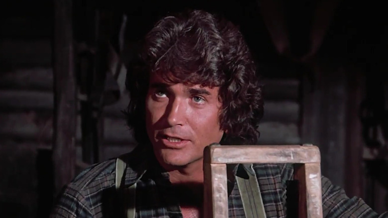 Michael Landon as Charles Ingalls, wood-working on Little House on the Prairie.