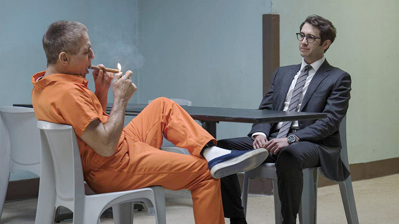 Tony Danza as Tony Sr. in a prison uniform smoking a cigar with Josh Groban as Tony Jr. wearing a suit on The Good Cop