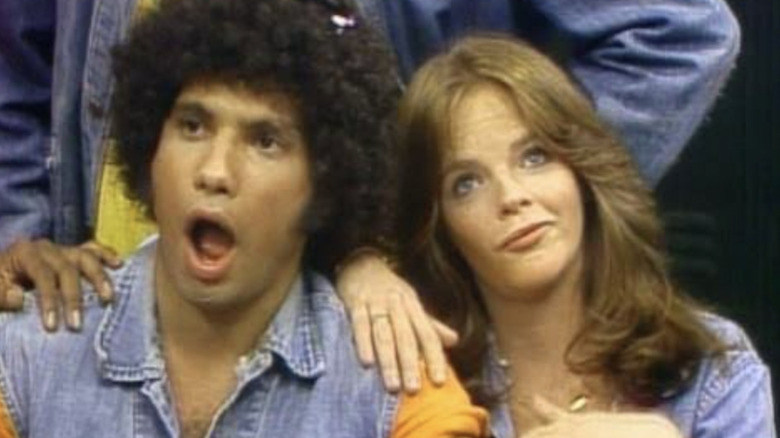 Juan Epstein with his mouth open in surprise sitting close to Rosalie "Hotsy" Totsy
