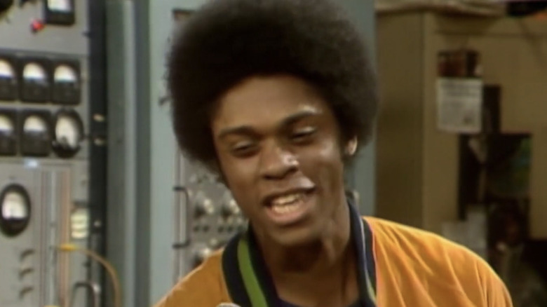 Freddie Washington talking into a microphone