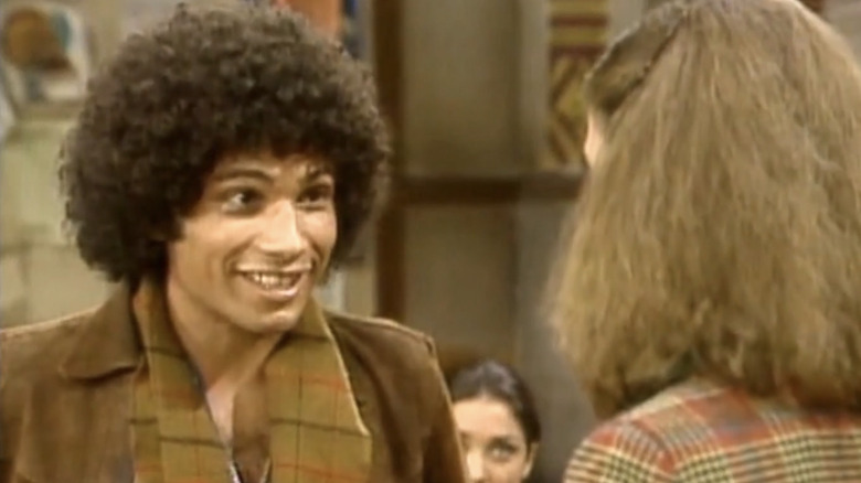 Juan Epstein smiling and doing a Fonzie impression for a girl