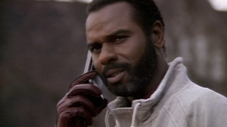A close-up of Captain Adam Fuller talking on the phone
