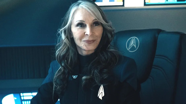 Beverly Crusher (Gates McFadden) sits smiling on Star Trek: Picard