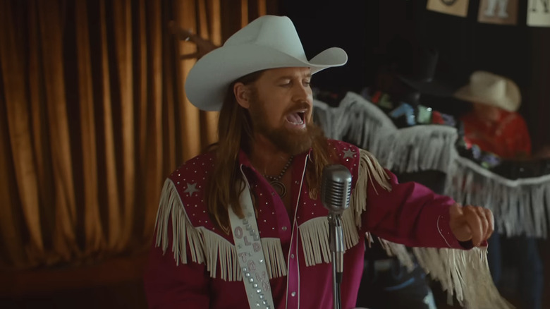 Billy Ray Cyrus sings and plays guitar in the music video for Old Town Road