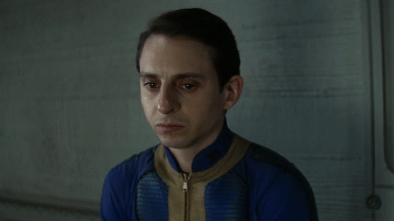 Moisés Arias as Norm MacLean, frowning in a vault in Fallout