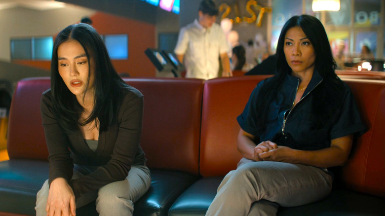 Lila and Amisha seated in the bowling alley