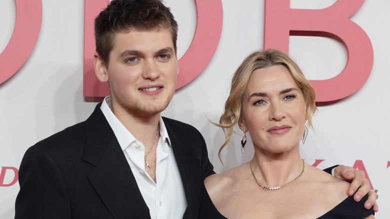 Joe Anders and Kate Winslet attend the "Goodbye June" World Premiere, smiling
