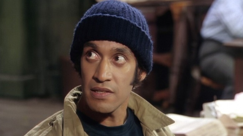 Gregory Sierra wearing a beanie as Detective Chano Amengual in Barney Miller