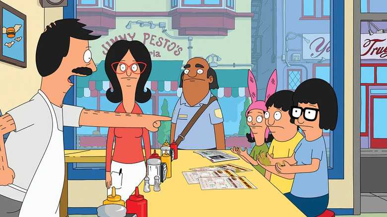 Bob Belcher aponta o dedo para Louise, Gene e Tina 