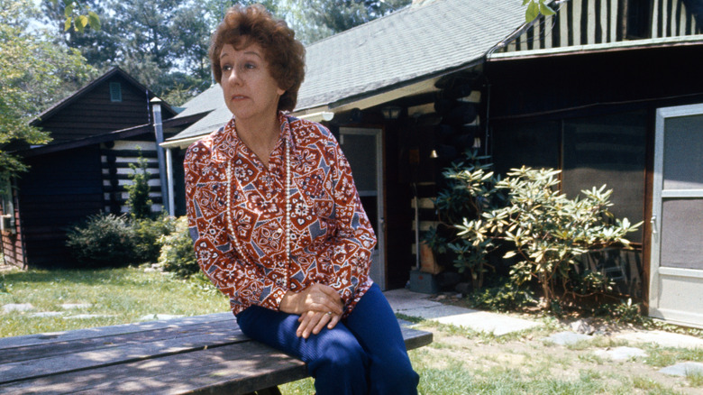 Jean Stapleton sitting on outdoor picnic table