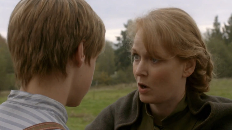 Cat Montgomery kneeling down and talking to her son Gabe Montgomery