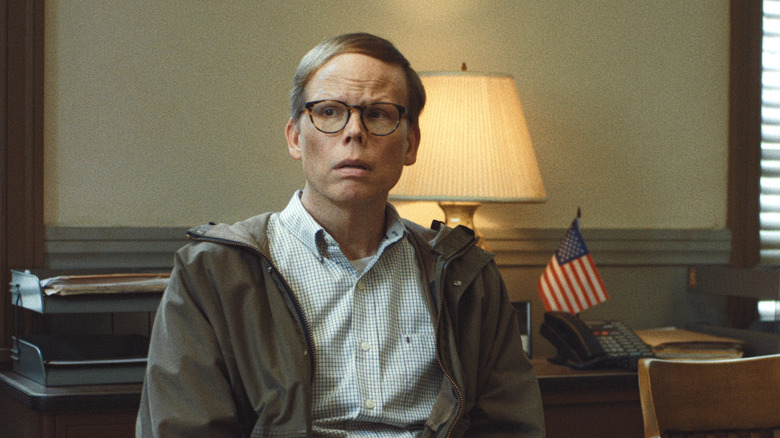 Dale wearing glasses and sitting in a chair in Widow's Bay