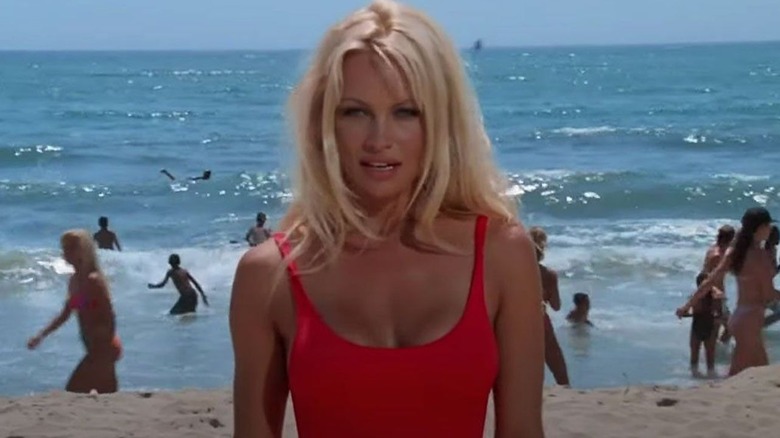 Pamela Anderson's Casey standing on the beach on "Baywatch"