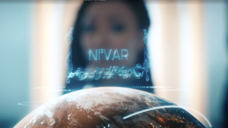 Michael Burnham looking at a projection of the name Ni'Var hovering above the planet in a Season 3 episode of "Star Trek: Discovery."