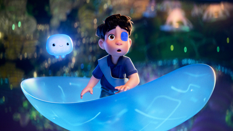 Elio floating on a blue disk on an alien world in Pixar's Elio