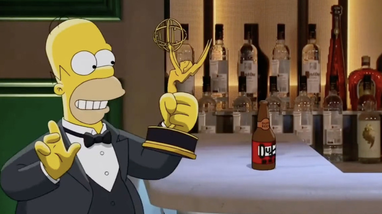 Homer Simpson at bar with Duff beer holding Emmy award