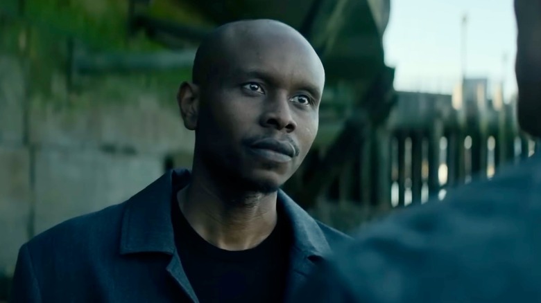 Osman speaking to Brandon Colby (not shown)