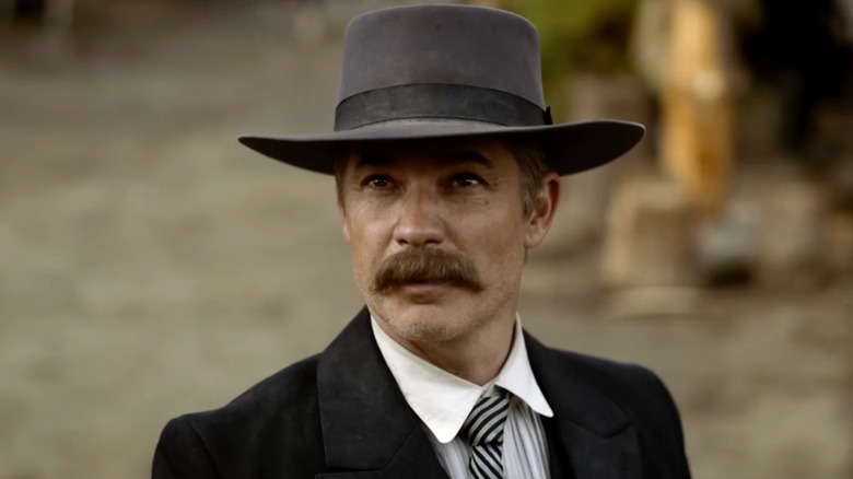 Seth Bullock looks up at something in Deadwood (2004)