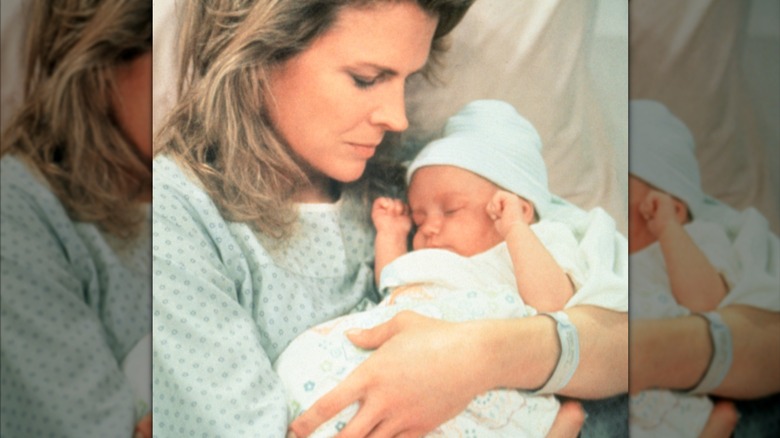 Murphy (Candice Bergen) holds her newborn son Avery on "Murphy Brown" (1988)