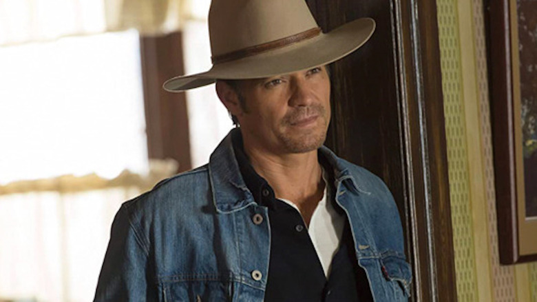 Raylan Givens standing in a doorway on "Justified"