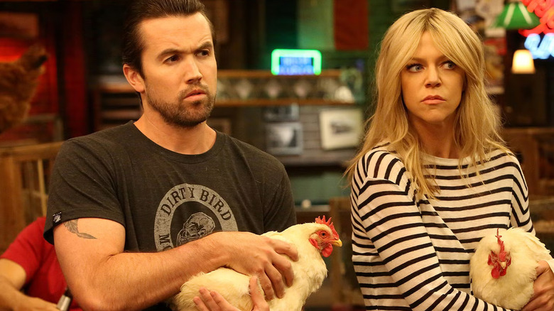 Rob and Dee both hold chickens in "It's Always Sunny in Philadelphia" (2005-present)