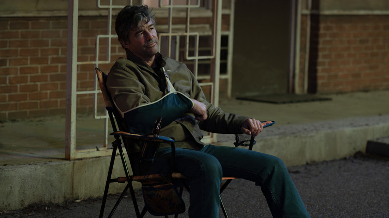 Hal Jordan looking surly in a parking lot in Lanterns