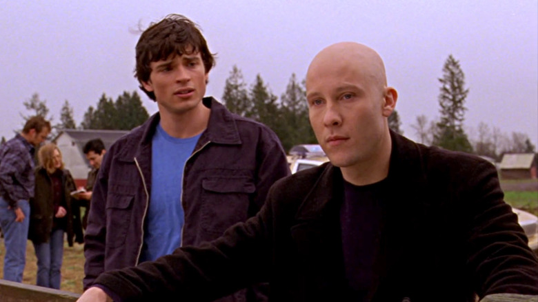 Clark Kent speaking to  Lex Luthor, who is looking away