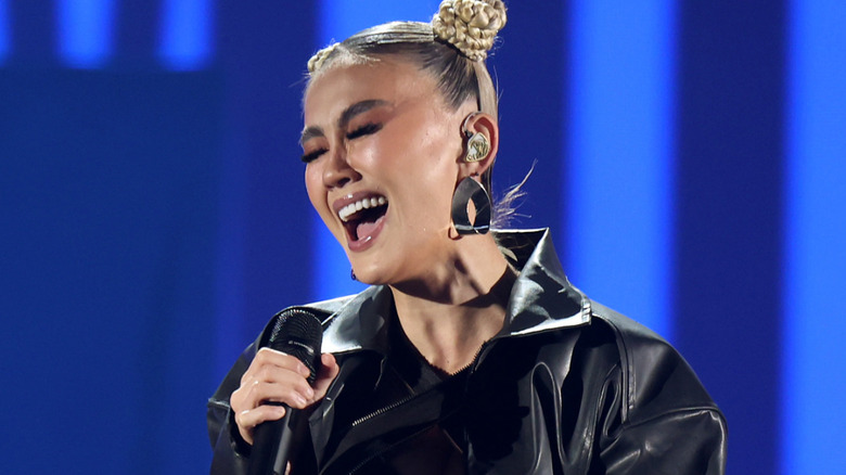 Agnez Mo sings on stage