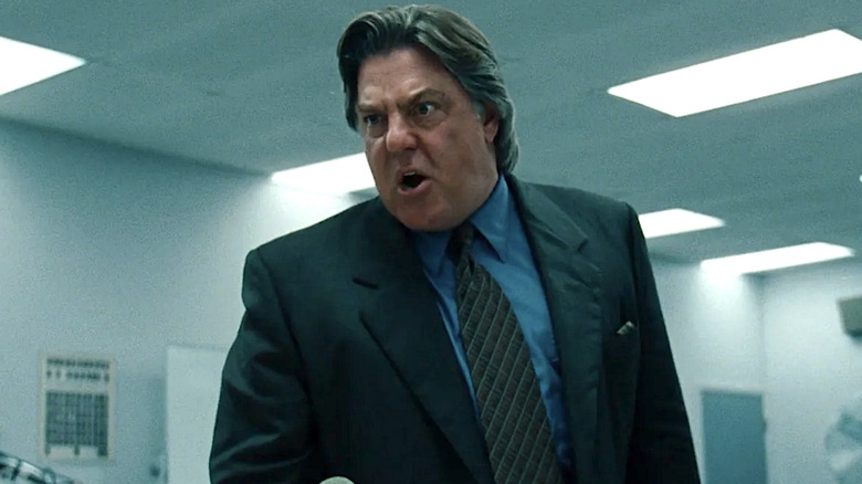 Ron Motley glaring and yelling at someone in the courtroom in The Insider