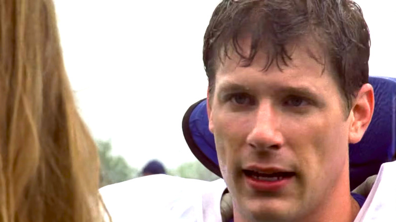 Matt Lauria as Luke Cafferty speaking to woman in the rain on "Friday Night Lights"