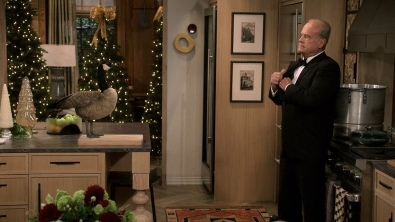 Frasier Crane in tuxedo standing in apartment decorated for Christmas