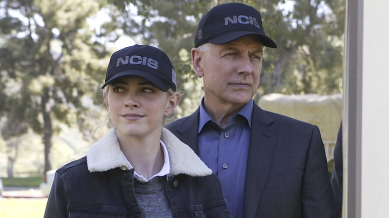 Ellie Bishop and Leroy Jethro Gibbs standing next to each other wearing black NCIS hats in "NCIS"