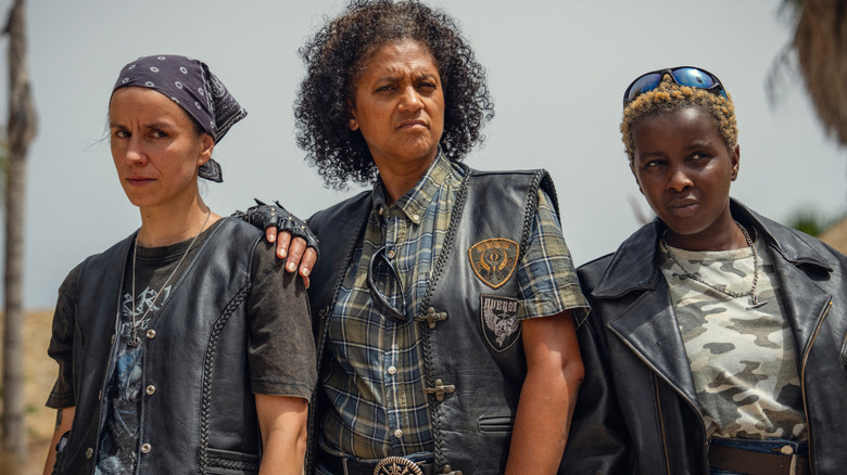 The Furies standing together in very cool leather jackets in "KAOS" (2024)