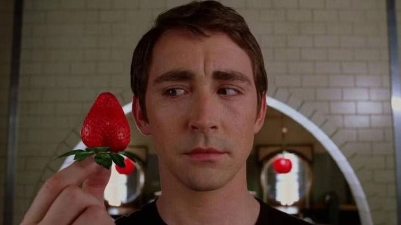 Ned (Lee Pace) holding a strawberry on "Pushing Daisies."