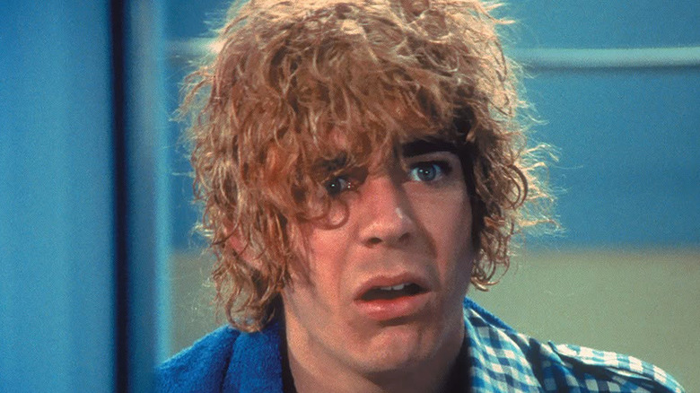 Mike Brady hwit orange hair scowling