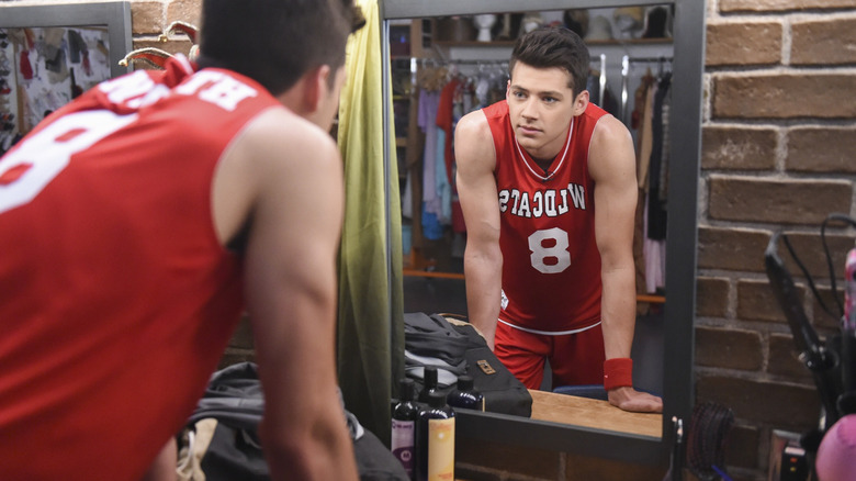 Matt Cornett as E.J. looking into a mirror in High School Musical: The Musical: The Series (2019)