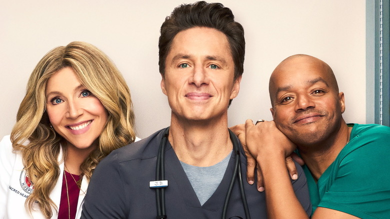 Sarah Chalke as Elliot Reid, Zach Braff as John Dorian, and Donald Faison as Christopher Turk in "Scrubs"