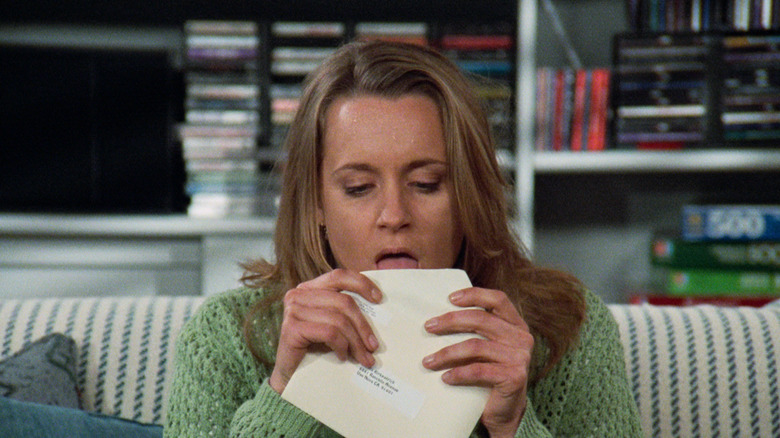 Susan licking one cheap envelope too many