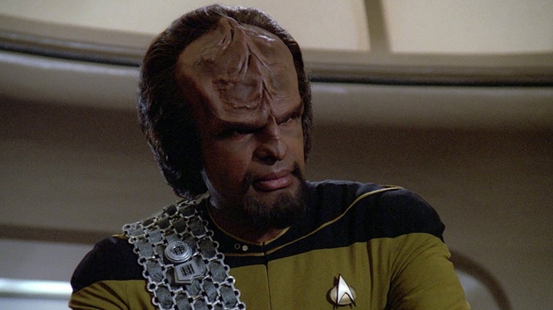 Worf looking off camera at someone with a piercing gaze during Season 2 of The Next Generation