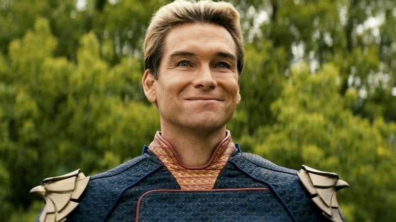Antony Starr as Homelander on The Boys, smiling and looking skyward in his costume